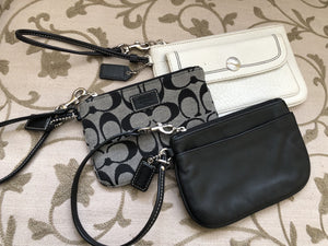 consignment bag - Coach black + white wristlet